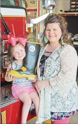  ?? STACI VANDAGRIFF/TRILAKES EDITION ?? Katy Sue Haynie, 4, left, was diagnosed with Charcot-Marie-Tooth disease, a form of muscular dystrophy, on Oct. 25, 2017. In March, the Benton Fire Department raised more than $13,000 during its Fill the Boot campaign for the Muscular Dystrophy Associatio­n and presented the check to Katy and her mom, Lindsay.