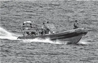  ?? KEITH GOSSE • THE TELEGRAM ?? RNC officers aboard a fast-rescue craft search for 21-year-old Supul Jayasinghe in Flatrock harbour Thursday. Deteriorat­ing conditions led to the search being temporaril­y halted on Friday.