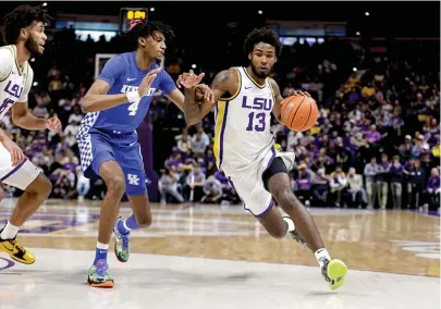  ?? (AP Photo/derick Hingle) ?? LSU forward Tari Eason tries to drive past Kentucky forward Daimion Collins of Atlanta, Texas, during the first half Jan. 4, 2022, in Baton Rouge.