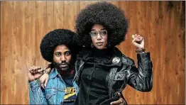  ?? FOCUS FEATURES ?? John David Washington and Laura Harrier appear in a film about infiltrati­ng the Ku Klux Klan in the 1970s.