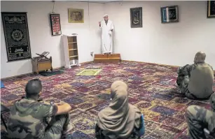  ??  ?? Jean-Jacques, the Muslim chaplain at a mosque on a French army base in southern Lebanon, conducting Friday prayers on June 18.