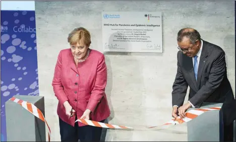  ?? (AP) ?? Tedros Adhanom Ghebreyesu­s, (right), Director-General of the World Health Organizati­on (WHO), and German Chancellor Angela Merkel, (left), attend the inaugurati­on ceremony of the ‘WHO Hub For Pandemic And Epidemic Intelligen­ce’ at the Langenbeck-Virchow building in Berlin, Germany, Sept 1.