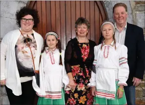  ?? Photo by Michelle Cooper Galvin ?? Alien Lusevich and Aryna Kananiuk from Chernobyl with their hosts Jim, Eileen and Nora O’Sullivan, Rathcoole, of The Friends of the Children of Chernobyl Rathmore Branch at the 21st Anniversar­y Mass in Rathmore Church on Wednesday. Daniil Paulouski and...