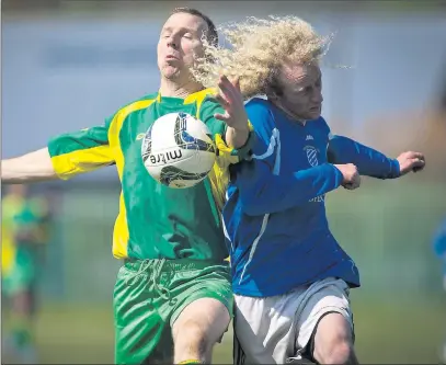  ??  ?? Rathnew's Ronan Coffey and Ashford's Finn Brooks compete for posession during the Wicklow Cup semi-final in Whitegates, Wicklow. Picture: Garry O'Neill