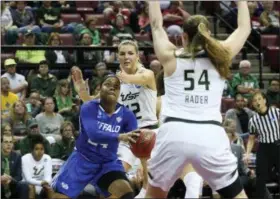  ?? THE ASSOCIATED PRESS ?? Buffalo’s Cierra Dillard drives around South Florida’s Maria Jespersen, center, and Alyssa Rader to attempt a shot in a first-round game of the NCAA women’s college basketball tournament, Saturday in Tallahasse­e, Fla.