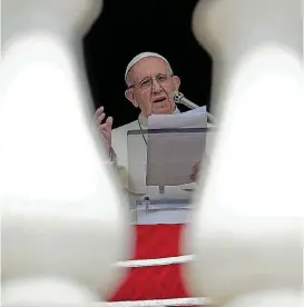  ?? [AP PHOTO] ?? Pope Francis delivers his speech Aug. 15 during the Angelus noon prayer from the window of his studio overlookin­g St. Peter’s Square at the Vatican.