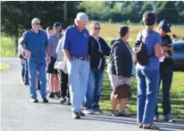  ?? STAFF PHOTO BY ERIN O. SMITH ?? A line of people hoping to get into the Highway 58 Fire Department Training Center for a Water and Wastewater Treatment Authority public meeting winds along the entrance on Thursday. The meeting was held to discuss the possibilit­y of a new sewer plant.