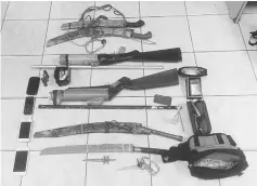  ??  ?? The weapons and other items seized from the suspects.