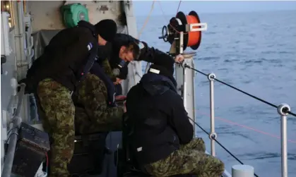  ?? ?? The Estonian navy conducting an undersea communicat­ions cable survey in the Gulf of Finland last week. Photograph: Reuters