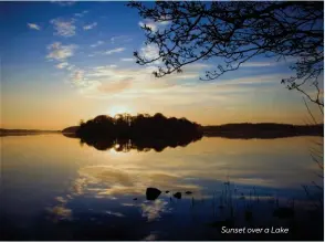  ??  ?? Sunset over a Lake