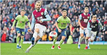  ??  ?? Unexpected bonus: Jay Rodriguez converts the controvers­ial penalty kick that put Burnley in control and deflated Bournemout­h