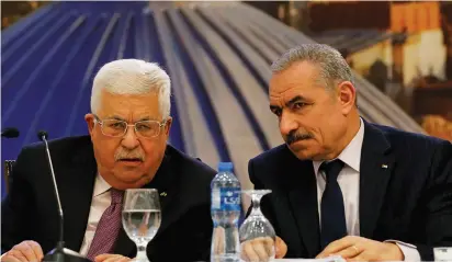  ?? (Reuters) ?? PA PRESIDENT Mahmoud Abbas delivers a speech in Ramallah as Prime Minister Mohammad Shtayyeh listens.