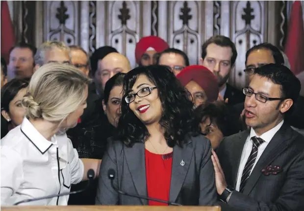  ?? / PATRICK DOYLE / THE CANADIAN PRESS ?? Liberal MP Iqra Khalid is congratula­ted by colleagues as she makes an announceme­nt about Motion 103 on Parliament Hill in Ottawa Wednesday. Supporters lauded the motion for tackling anti-Muslim sentiment in Canada, while opponents suggested the motion...