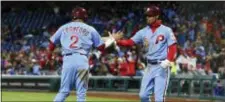  ?? DERIK HAMILTON — THE ASSOCIATED PRESS ?? The Phillies’ Nick Williams, right, celebrates with J.P. Crawford after scoring during the second inning against the Pirates on Thursday.