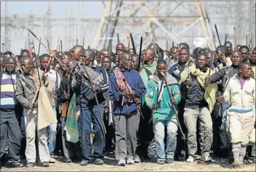  ?? Picture: SUNDAY TIMES, KEVIN SUTHERLAND ?? ILL-FATED: Workers on the march at the Lonmin platinum mine in the Marikana area shortly before police fired at the crowd, killing 34 people and injuring scores more.