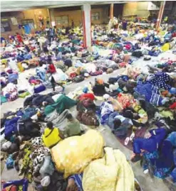  ??  ?? HARARE: Zimbabwe’s tobacco farmers sleep in an auction house at the Tobacco Sales Floor in Harare in this Wednesday, May, 17, 2017 photo. Many Zimbabwean tobacco farmers are making big sales this season, but they don’t feel they’re benefiting from the...