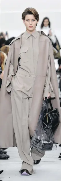  ?? BERTRAND GUAY/GETTY IMAGES ?? “Trench coats are a classic staple and are updated for spring with unexpected details and new proportion­s,” says Shannon Schafer, senior fashion director at Nordstrom.