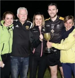  ?? Pics: ?? Enniscrone/Kilgass forward Mark Gordon celebrates with his family. INSET: Joe Taaffe presents the trophy to John Paul Carden. Tom Callanan.