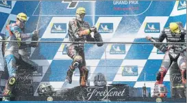  ?? FOTO: AP ?? Mir y Vierghe comparten podio con Binder. Gran duelo de ex campeones Moto3