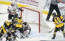  ?? SCOTT GARDNER THE HAMILTON SPECTATOR ?? Hamilton’ Ryan Moore scores the game-winning goal in overtime in OHL playoff action against Niagara Saturday night in Hamilton.