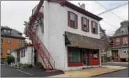  ?? DONNA ROVINS — DIGITAL FIRST MEDIA ?? An exterior view of the Spat and Slipper on Charlotte Street in Pottstown. The business is owned by Neil Gazzillo, who is selling the business and building after 55 years as a barber.