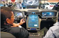  ??  ?? Hyundai was one manufactur­er at CES showing how touch screens will make everything simpler.