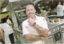  ??  ?? Chef Aaron Silverman, owner of Rose’s Luxury and Pineapple and Pearls restaurant­s, poses inside Pineapple And Pearls’ kitchen in Washington, DC.