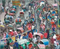  ?? SUVRA KANTI DAS VIA NEWSCOM ?? Hundreds of rickshaws are stuck in a traffic jam in Dhaka, Bangladesh, on Dec 6. Every year the country faces the challengin­g task of managing a large number of illegal rickshaws operating without necessary permits.