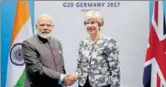  ?? PTI ?? Prime Minister Narendra Modi meets Britain's Prime Minister Theresa May on the sidelines of G20 Summit in Hamburg.