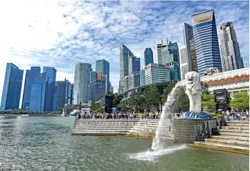  ??  ?? Singapore economy grew by 3.2 per cent in 2018, a moderation from the 3.9 per cent growth recorded in 2017. — Reuters photo