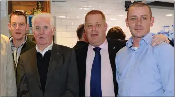  ?? Photo by Michelle Cooper Galvin ?? Michael Quinlan (second from left) with Peter, Liam and Ronan Quinlan at the opening of the new Quinlan’s Fresh Seafood and Fish and Chips premises at The Square, Killorglin.