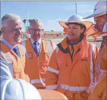  ??  ?? Deputy Prime Minister Michael Mccormack (left) and Member for Parkes Mark Coulton (second from left) with Inland Rail workers near Parkes last month.