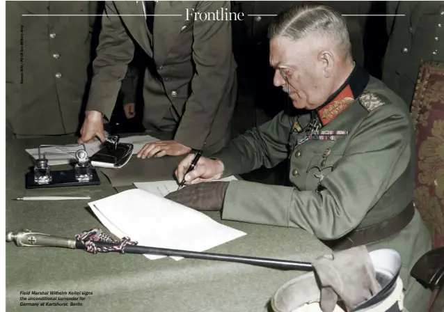  ??  ?? Field Marshal Wilhelm Keitel signs the unconditio­nal surrender for Germany at Karlshorst, Berlin