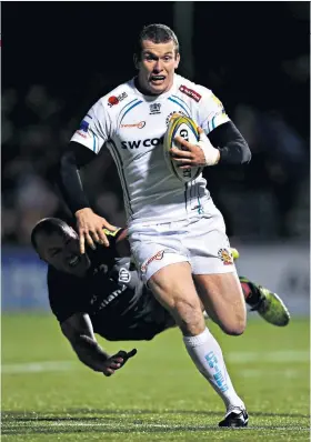  ??  ?? Find the gap: Exeter’s Ian Whitten evades the clutches of Saracens’ Schalk Burger