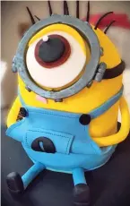  ??  ?? Eye-cing on the cake: A Minion adorns the top of one creation