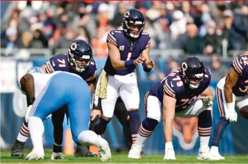  ?? QUINN HARRIS/GETTY IMAGES ?? Justin Fields’ willingnes­s to plow into opponents not only resulted in a touchdown against the Lions — it’s also emboldenin­g his teammates.