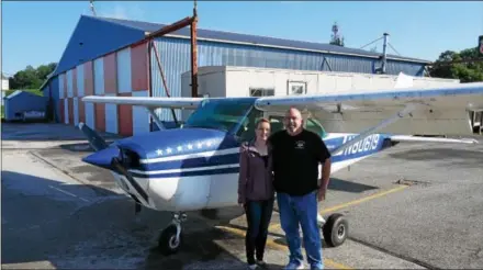  ?? FRAN MAYE — DIGITAL FIRST MEDIA ?? Meghan Callahan prepares to take her father, Michael, up for a flight at New Garden Flying Field.