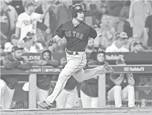  ?? RICHARD MACKSON/USA TODAY SPORTS ?? Red Sox outfielder Andrew Benintendi, who hit just two home runs after the All-Star break, will bat leadoff this year.