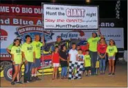  ?? RICH KEPNER - FOR DIGITAL FIRST MEDIA ?? Race winner Duane Howard, center, poses with members of Hunt the Giant Christian outreach program on Hunt the Giant night at Big Diamond on Aug. 10.