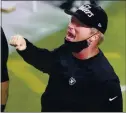  ?? ISAAC BREKKEN
—THE ASSOCIATED
PRESS ?? Raiders head coach Jon Gruden celebrates after defeating the Saints on Monday in Las Vegas.