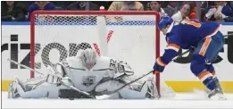  ?? MARY ALTAFFER — THE ASSOCIATED PRESS ?? Kings goaltender Jonathan Quick (32) makes a save against the Islanders' Matt Martin during L.A.'s 3-2victory on Friday at New York. The Kings play the Rangers today.