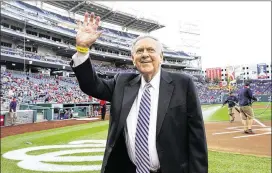  ?? ALEX BRANDON / AP ?? Former Washington Senators broadcaste­r Bob Wolff waves to the crowd during a pregame ceremony to honor him before a baseball game between the Washington Nationals and the Cincinnati Reds at Nationals Park in Washington.