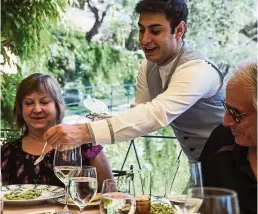  ??  ?? Fine wine and attentive waiters are a byword at the Hotel Splendido in Portofino, Italy.