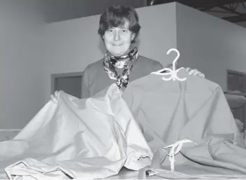  ?? [SEAN HEEGER] ?? Phyllis Winfield with the medical gowns she's now making due to a general shortage of gear.