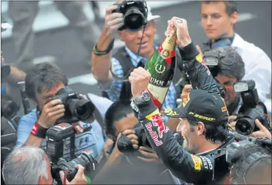  ?? Picture: AFP ?? OPEN FIELD: Red Bull Racing’s Australian driver Mark Webber celebrates at the Circuit de Monaco in Monte Carlo yesterday, after the Monaco Formula One Grand Prix. There have been six different winners in six races this season.