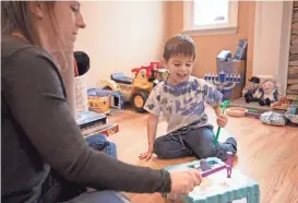  ?? EMMA H. TOBIN/AP ?? Ilana Diener plays with her son before a Moderna vaccine trial appointmen­t. Moderna said in March its vaccine works in the youngest kids.