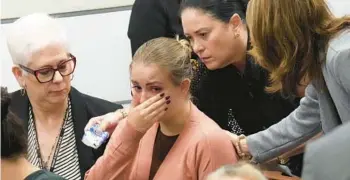  ?? AMY BETH BENNETT/SOUTH FLORIDA SUN SENTINEL ?? Meghan Petty is comforted as she takes a break from giving a statement about her sister, Alaina, during the sentencing hearing for the Marjory Stoneman Douglas High School shooter.