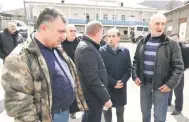  ?? ?? Villagers, including Aghbalyan (right), a end a gathering outside the Voskepar village council in northeaste­rn Armenia.