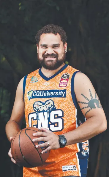  ??  ?? COLOURFUL VISION: Cairns artist Teho Ropeyarn has created an indigenous jersey for the Cairns Taipans NBL team to wear in games this season. Picture: BRENDAN RADKE