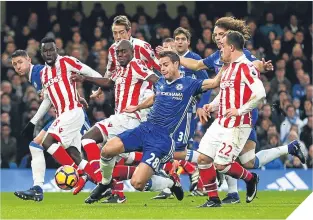  ??  ?? Chelsea defender Cesar Azpilicuet­a clears under pressure.